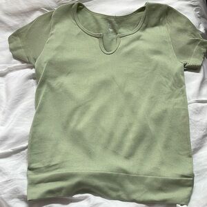 This is a Sage green top! It’s from TJmaxx. It is a tight fitting top!